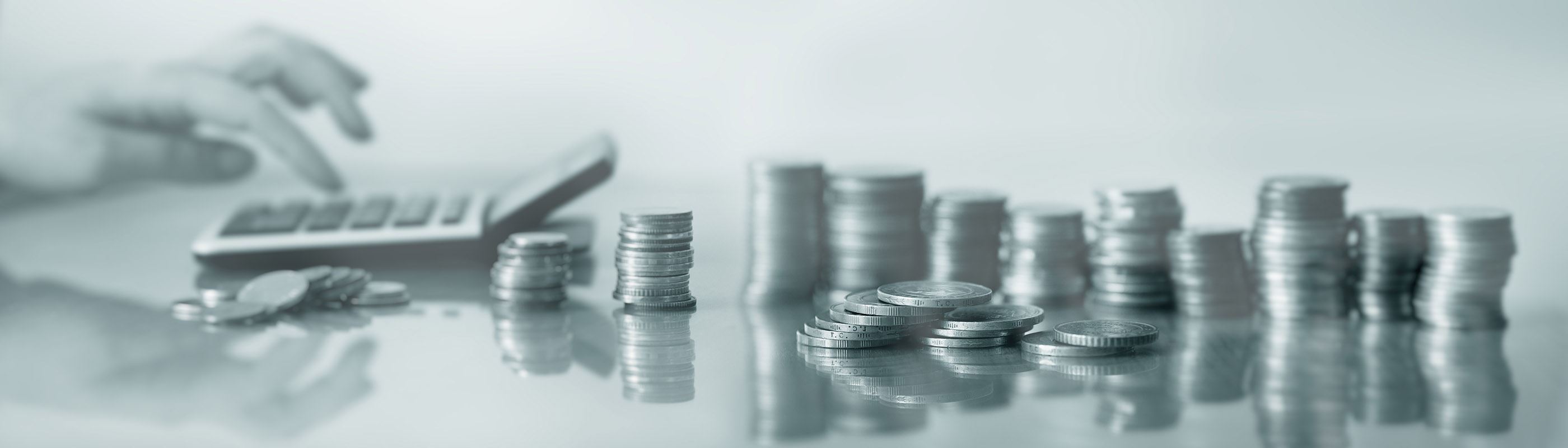 Stacked coins with a calculator