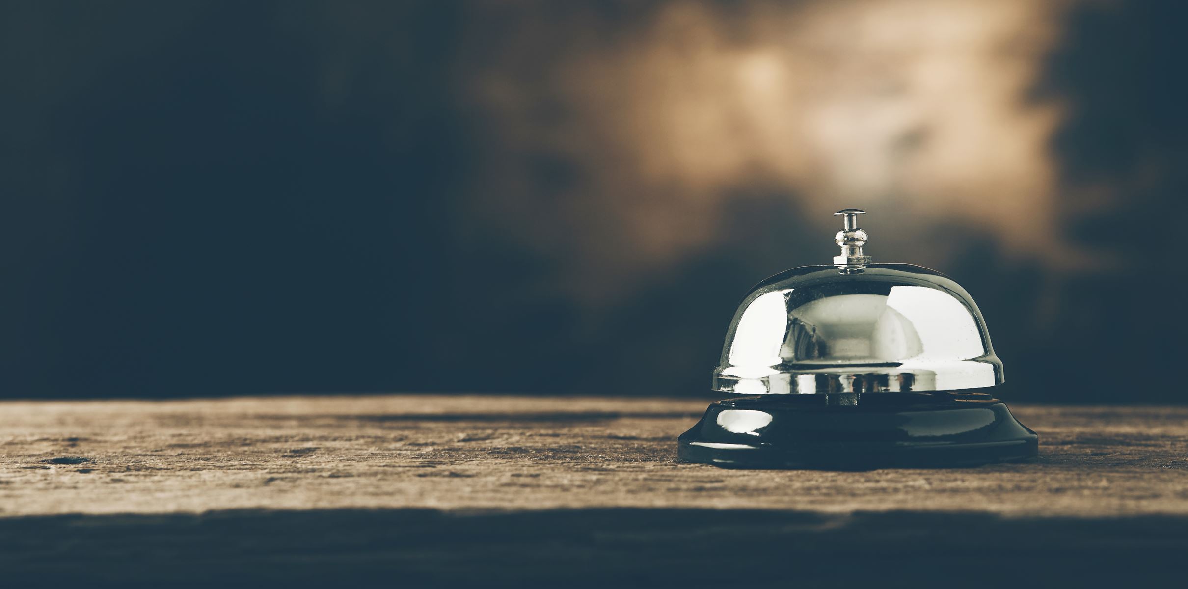 small table top bell sitting on a table