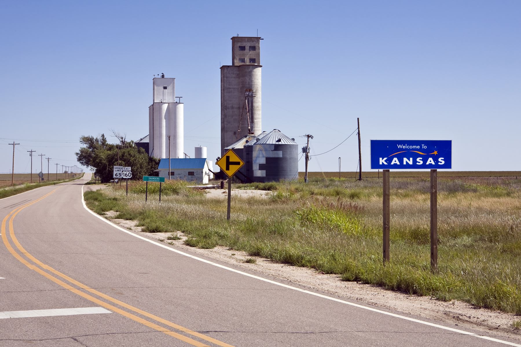 country road headed to a small Kansas town